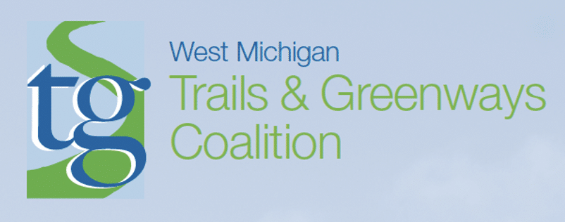 Logo of West Michigan Trails & Greenways Coalition with stylized green trail design.