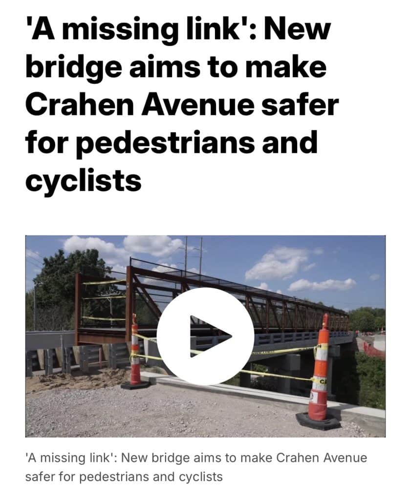 New pedestrian bridge on Crahen Avenue enhances safety for pedestrians and cyclists, featuring caution barriers.